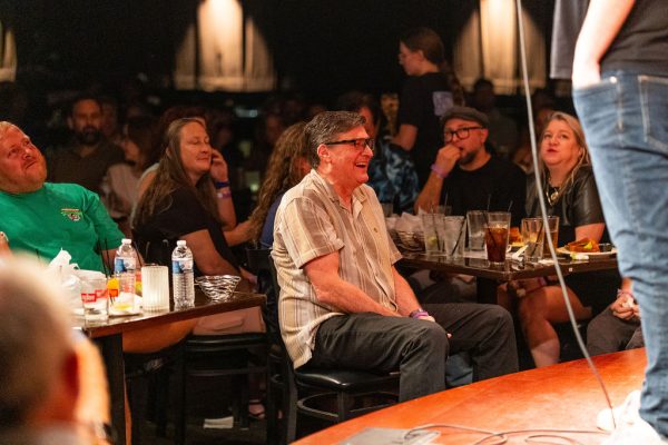 Guests at their tables laughing in 2025