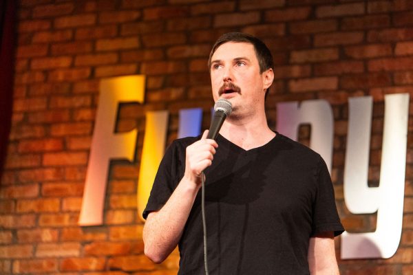 Close portrait of a comedian on the FunnyBone stage in 2025