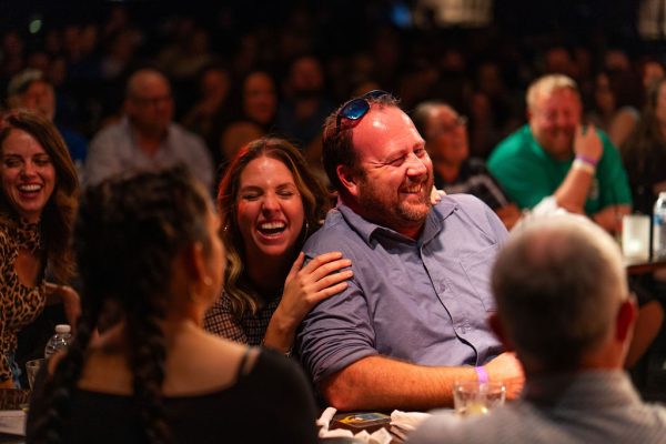 Audience members laughing during the 2025 Comedy Jam